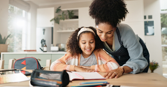 mother helping daughter with homework